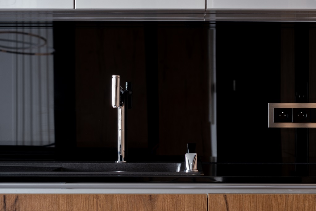 Kitchen with black backsplash